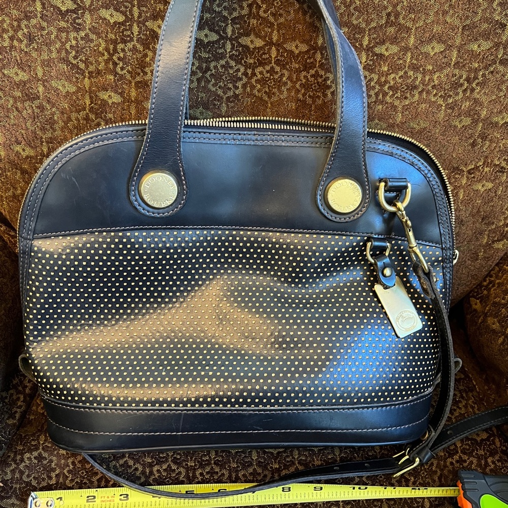 Dooney & Bourke Cabrio Black and Tan perforated bag in EUC.